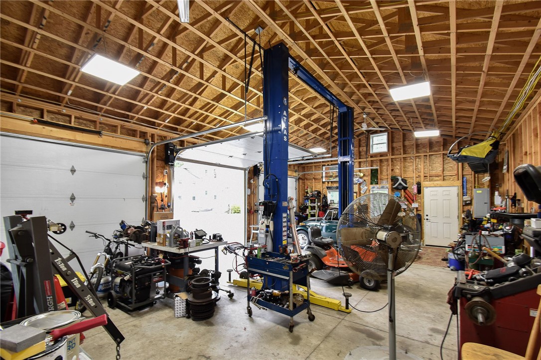 195 Town Farm Road Coventry, RI 02816 - Photo 4 of 47 Interior of garage with professional lift