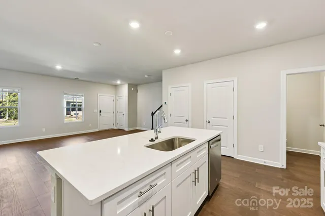 a kitchen with a sink and a refrigerator