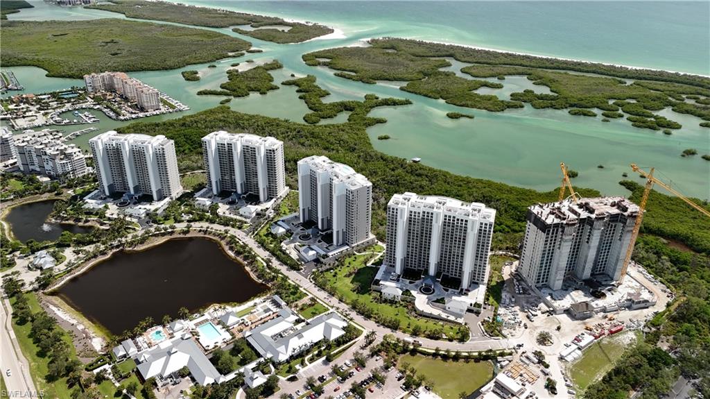 13955 Old Coast Road, Unit PH05 Naples, FL 34110 - Photo 3 of 8 a view of swimming pool with a patio