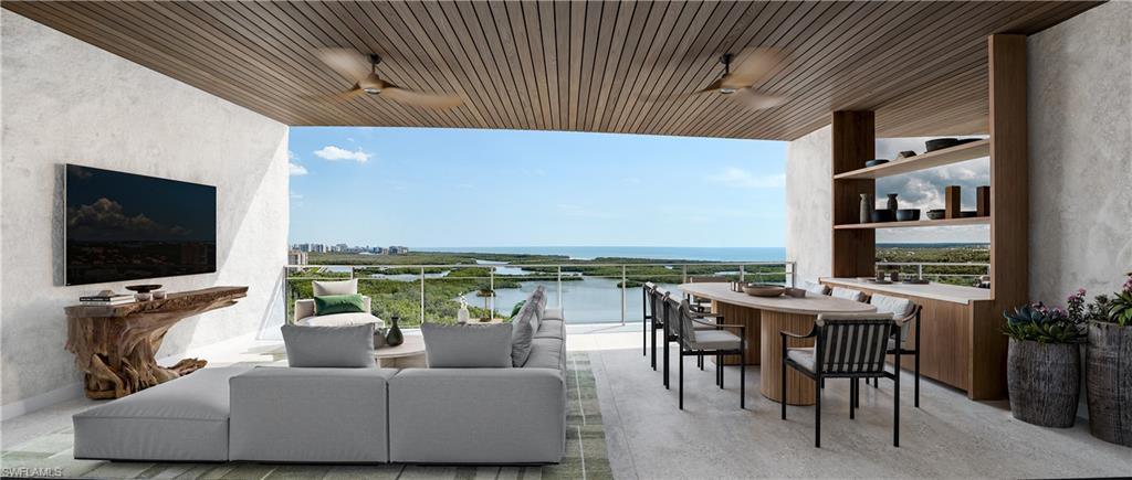 13955 Old Coast Road, Unit PH05 Naples, FL 34110 - Photo 6 of 8 a living room with furniture and a flat screen tv
