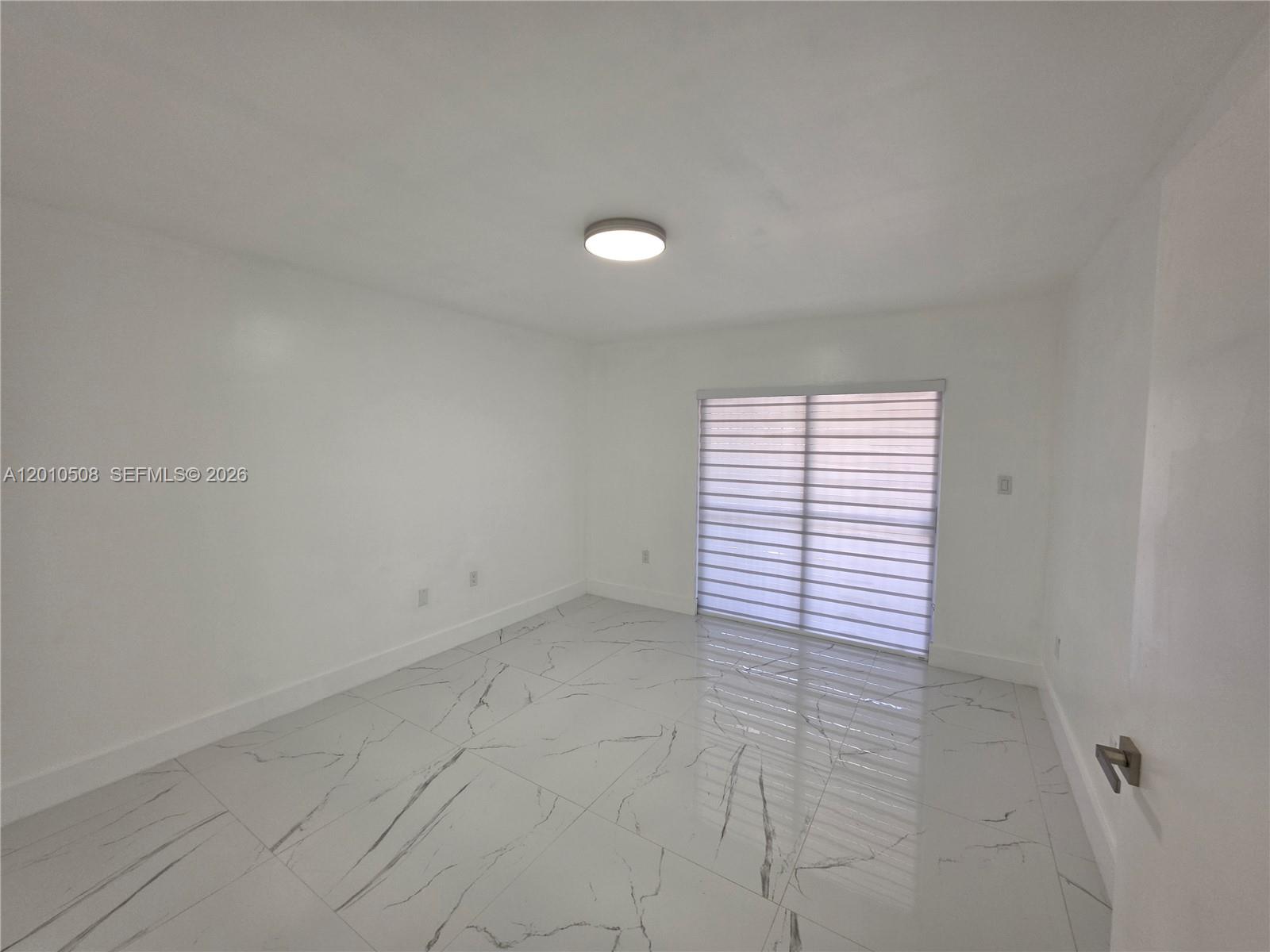 14775 Southwest 83rd Lane, Unit 14775 Miami, FL 33193 - Photo 12 of 26 master bedroom view to rear sliding door to covered patio