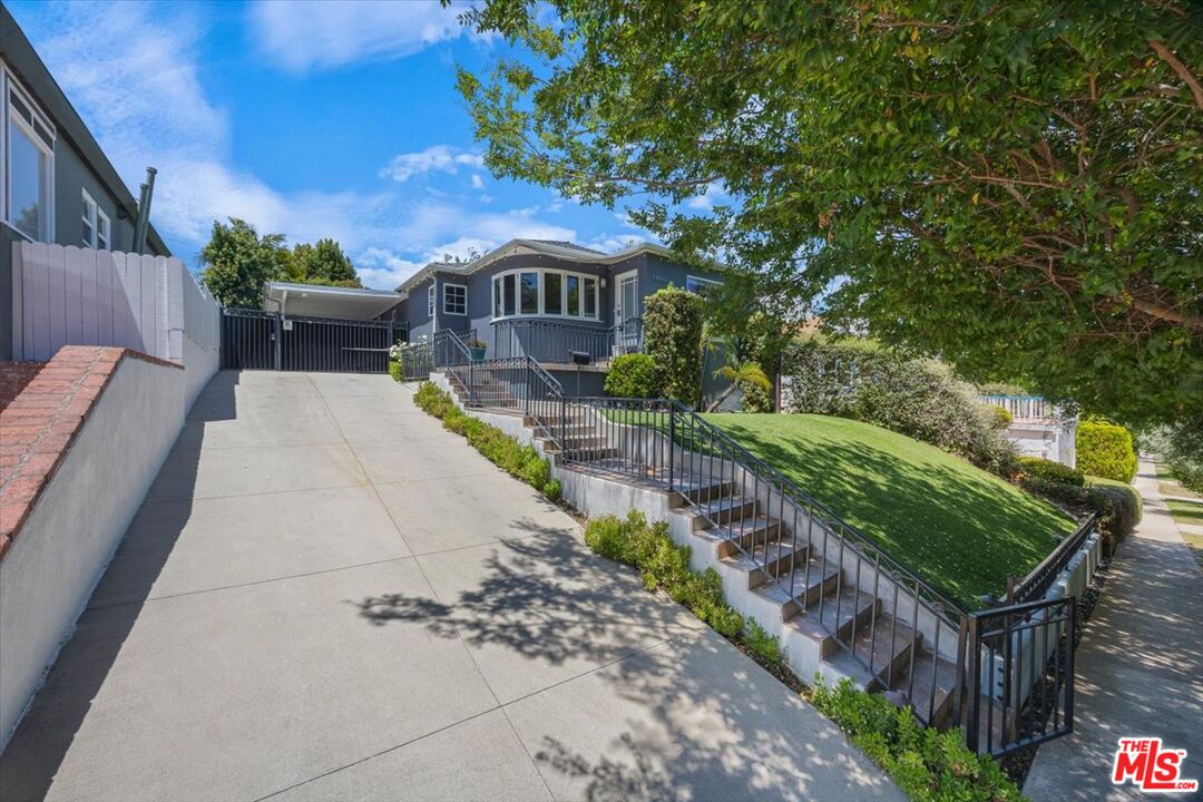 14041 Roblar Road Sherman Oaks, CA 91423 - Photo 46 of 47 a front view of a house with a yard