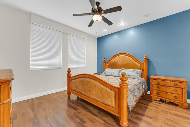 a bedroom with bed and a window