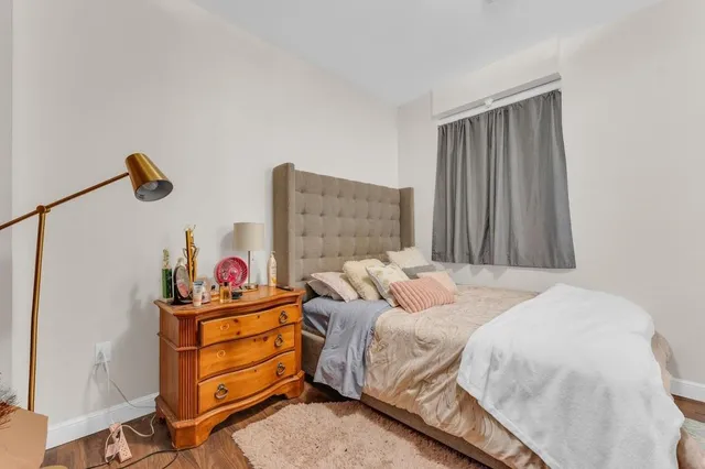 a bathroom with a toilet a sink and a mirror