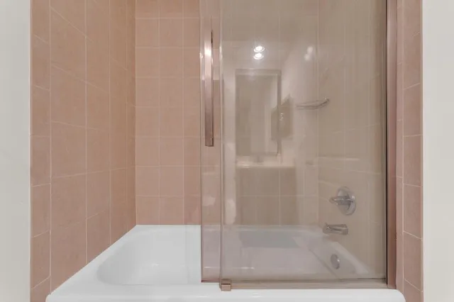 a bedroom with a bed and a bookshelf