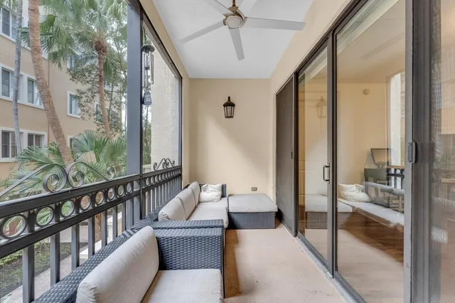 a living room with furniture and a painting on the wall