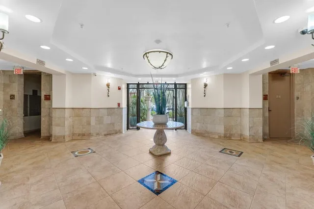 a view of a building with potted plants