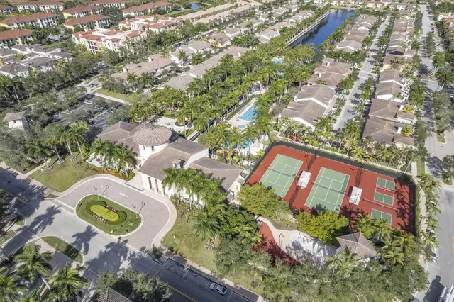 an aerial view of residential building with green space