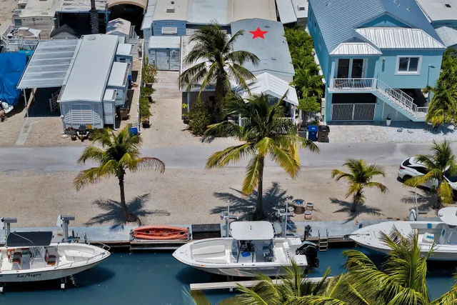a view of a swimming pool with outdoor seating