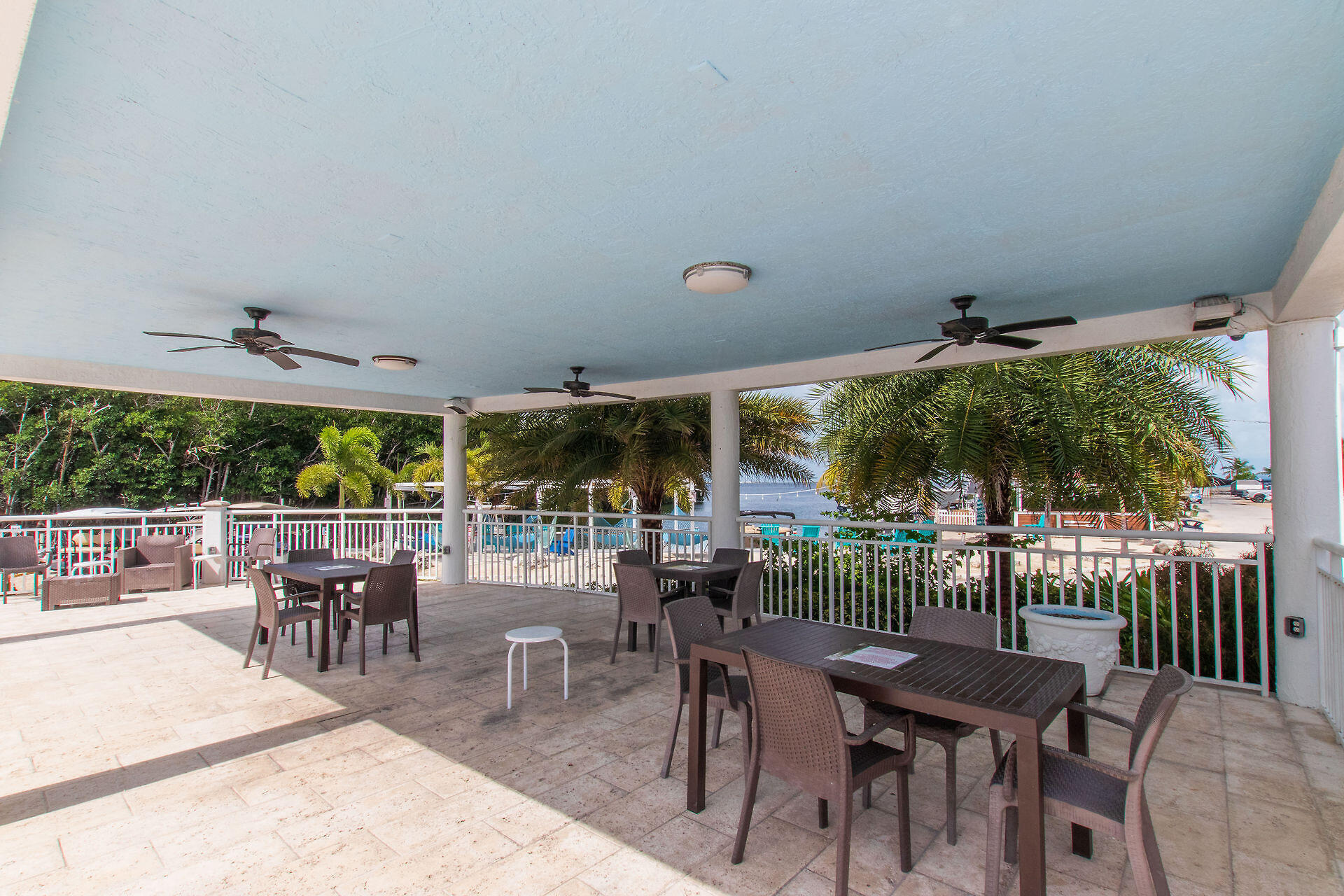 325 Calusa Street, Unit 250 Key Largo, FL 33037 - Photo 25 of 63 a view of a patio with a table and chairs
