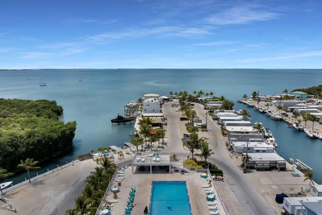 a view of a patio with table and chairs potted plants with wooden floor