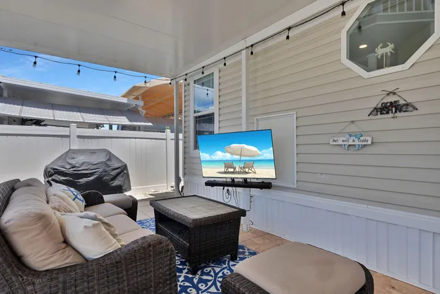 a kitchen with stainless steel appliances kitchen island granite countertop a dining table and chairs