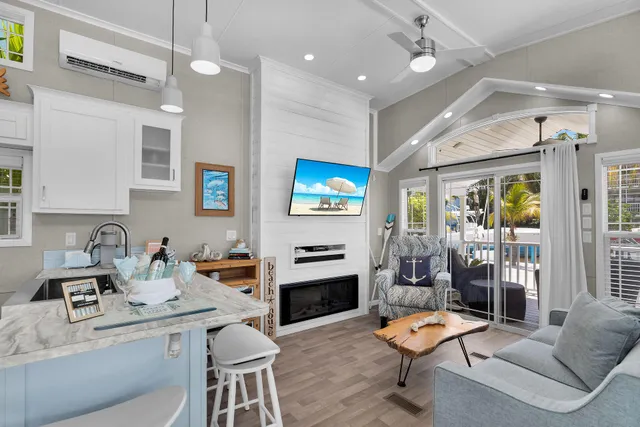 a bedroom with a large bed and a tv