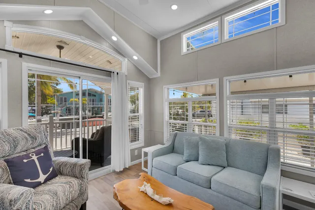 a bedroom with a bed and a lamp on dresser