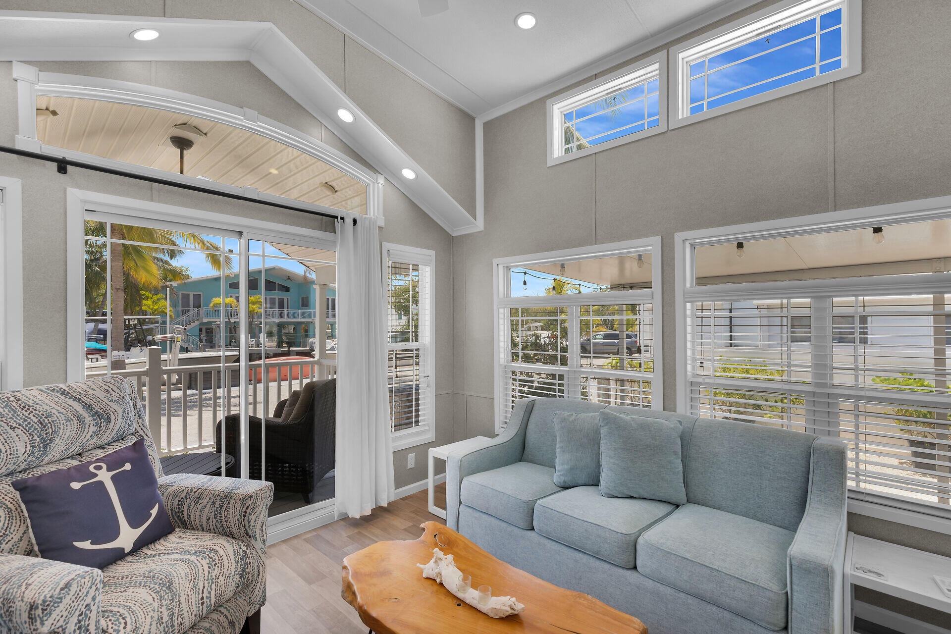 325 Calusa Street, Unit 250 Key Largo, FL 33037 - Photo 46 of 63 a living room with furniture and a large window