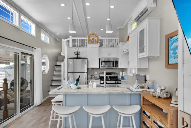 a bed room with a bed and a large window