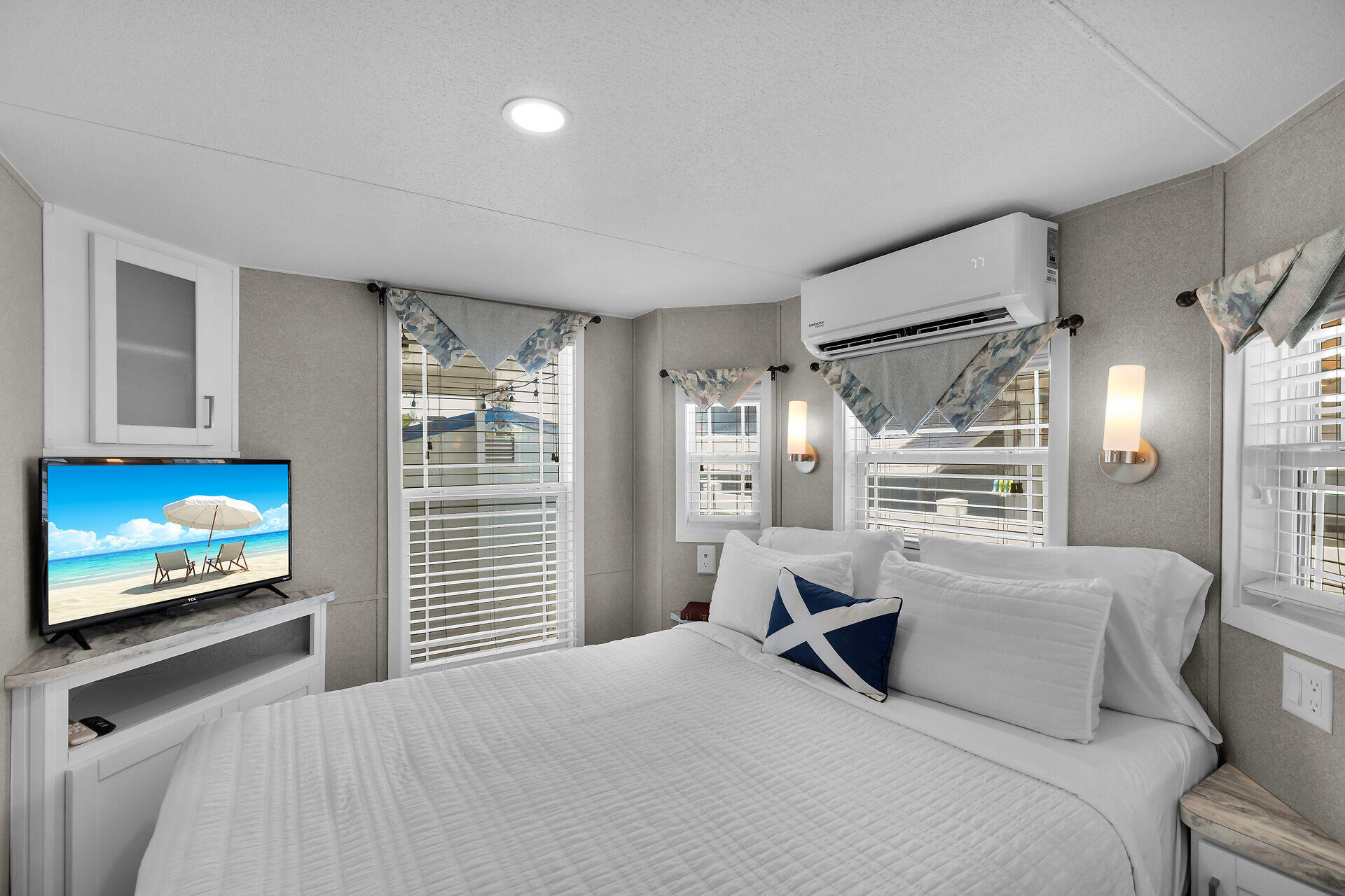 325 Calusa Street, Unit 250 Key Largo, FL 33037 - Photo 55 of 63 a bedroom with a large bed and a tv