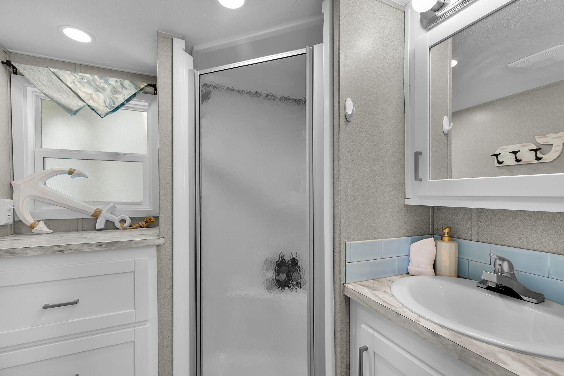 325 Calusa Street, Unit 250 Key Largo, FL 33037 - Photo 58 of 63 a bathroom with a granite countertop sink and a mirror