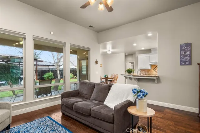 a sink with granite countertop a sink and a wooden cabinets