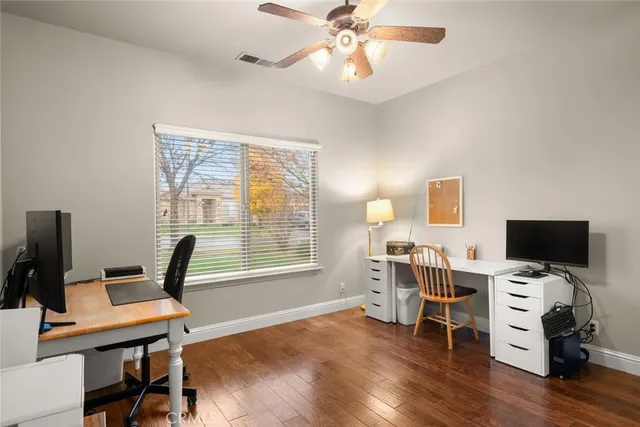an aerial view of a house with a swimming pool