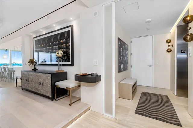 a living room with furniture white walls and white walls