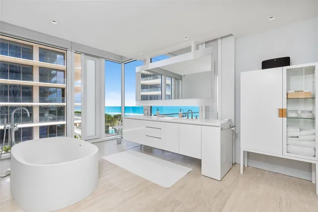 a spacious bedroom with a bed and a window