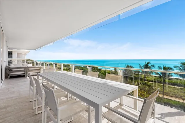 a view of a chairs and table in the patio