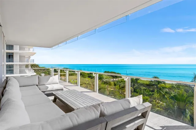 a dinning table and chairs in a patio
