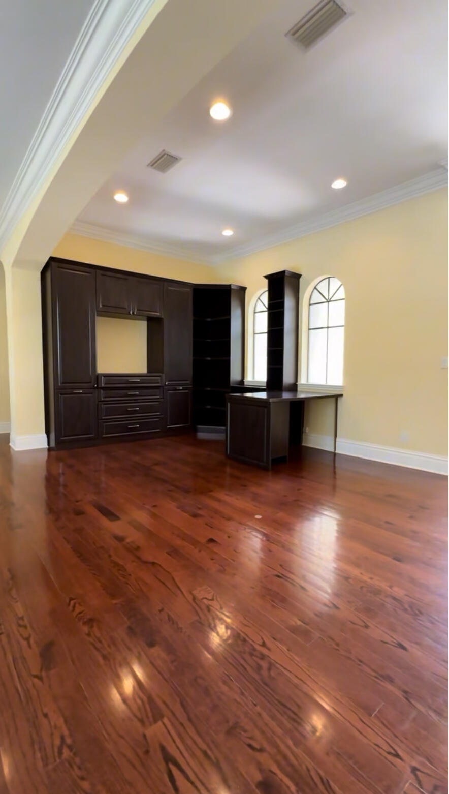 9407 Bridgebrook Drive Boca Raton, FL 33496 - Photo 15 of 32 an empty room with wooden floor and windows