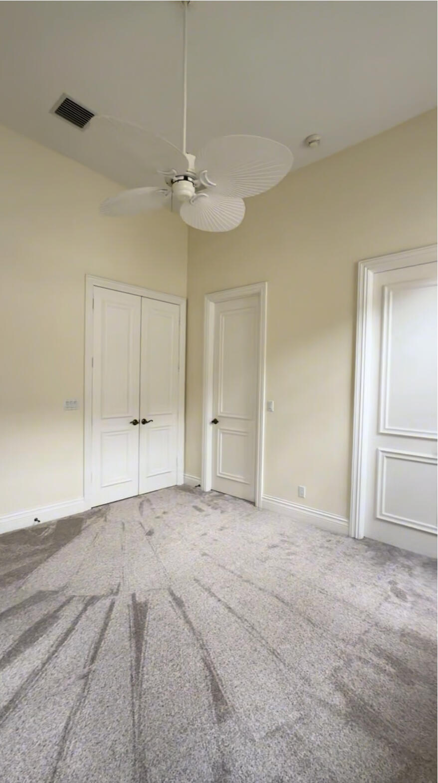 9407 Bridgebrook Drive Boca Raton, FL 33496 - Photo 19 of 32 an empty room with fan and windows