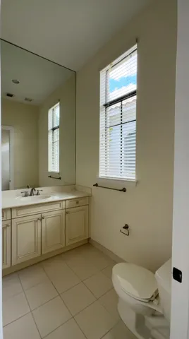 an empty room with a fireplace and window