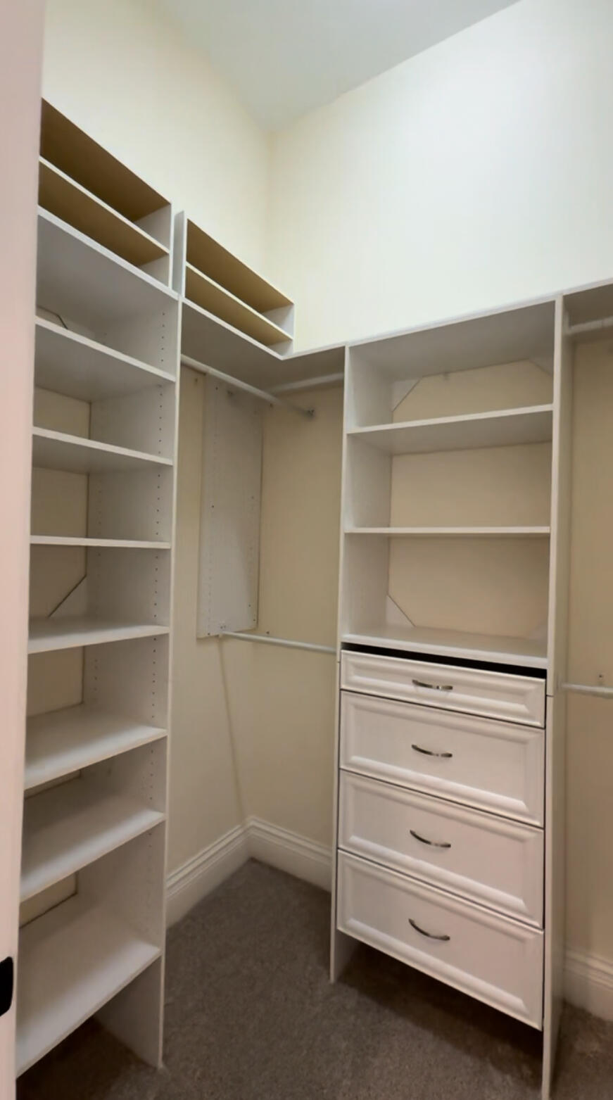 9407 Bridgebrook Drive Boca Raton, FL 33496 - Photo 21 of 32 a view of walk in closet with empty racks