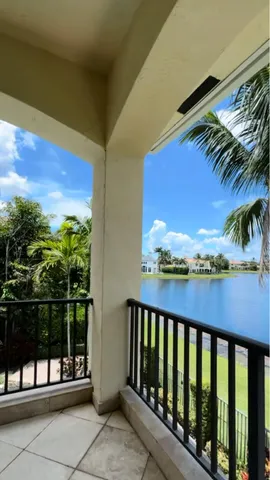 a view of an entryway with wooden floor and windows