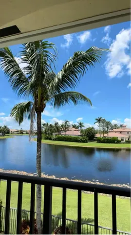 a view of a swimming pool with a table and chairs