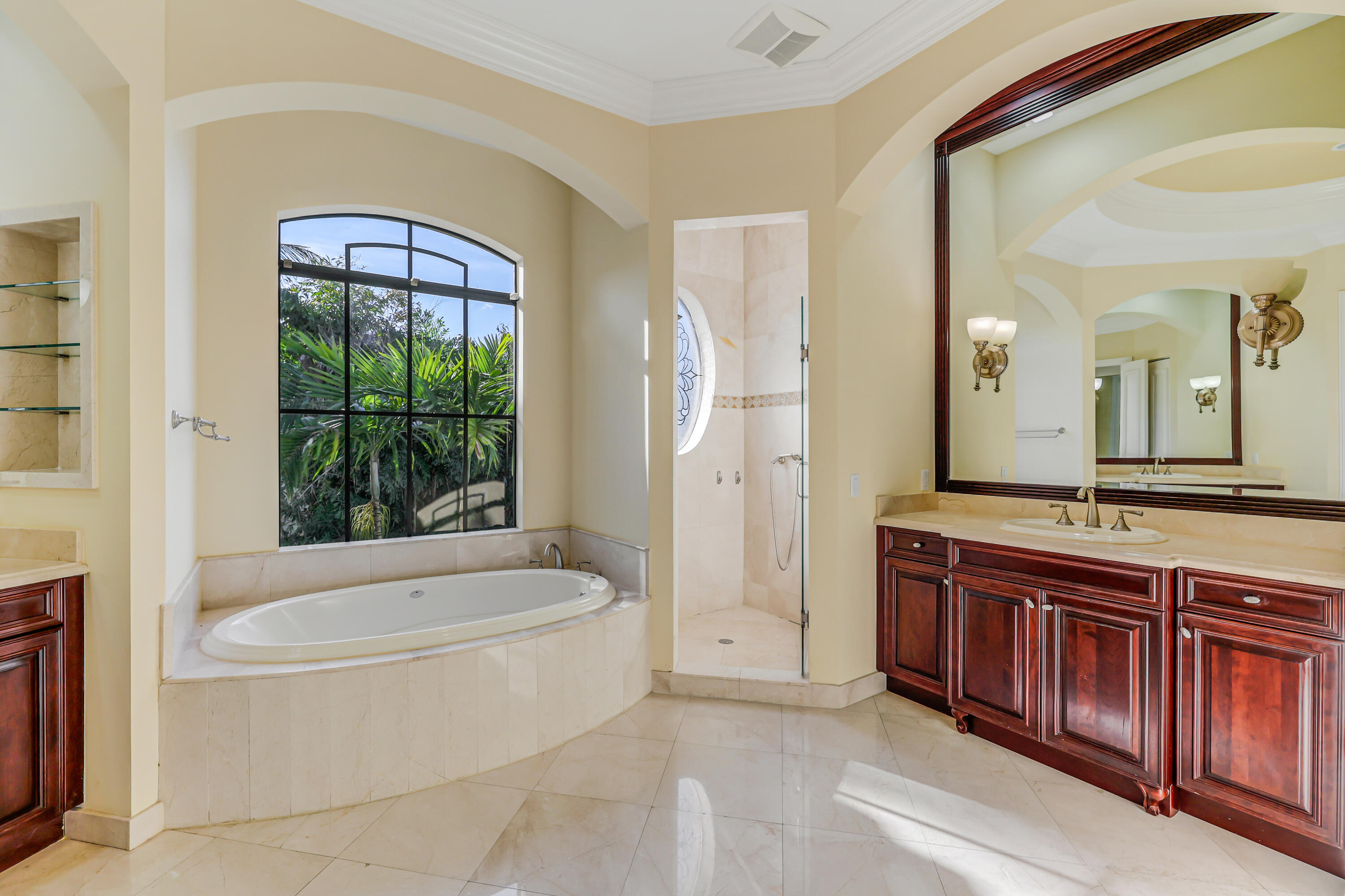 9407 Bridgebrook Drive Boca Raton, FL 33496 - Photo 40 of 89 a bathroom with a tub a sink and a large mirror