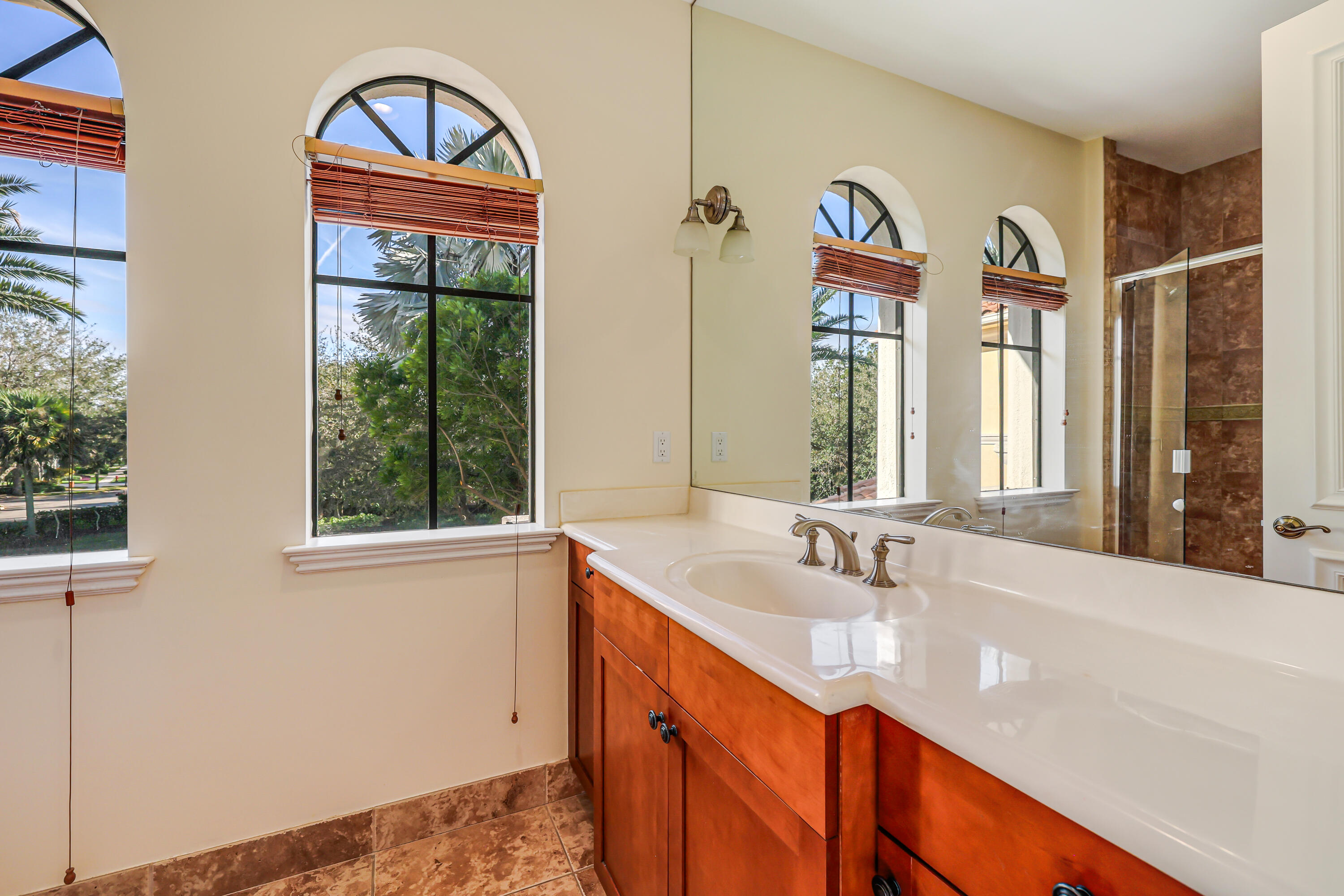 9407 Bridgebrook Drive Boca Raton, FL 33496 - Photo 57 of 89 a bathroom with a sink a vanity and a large mirror