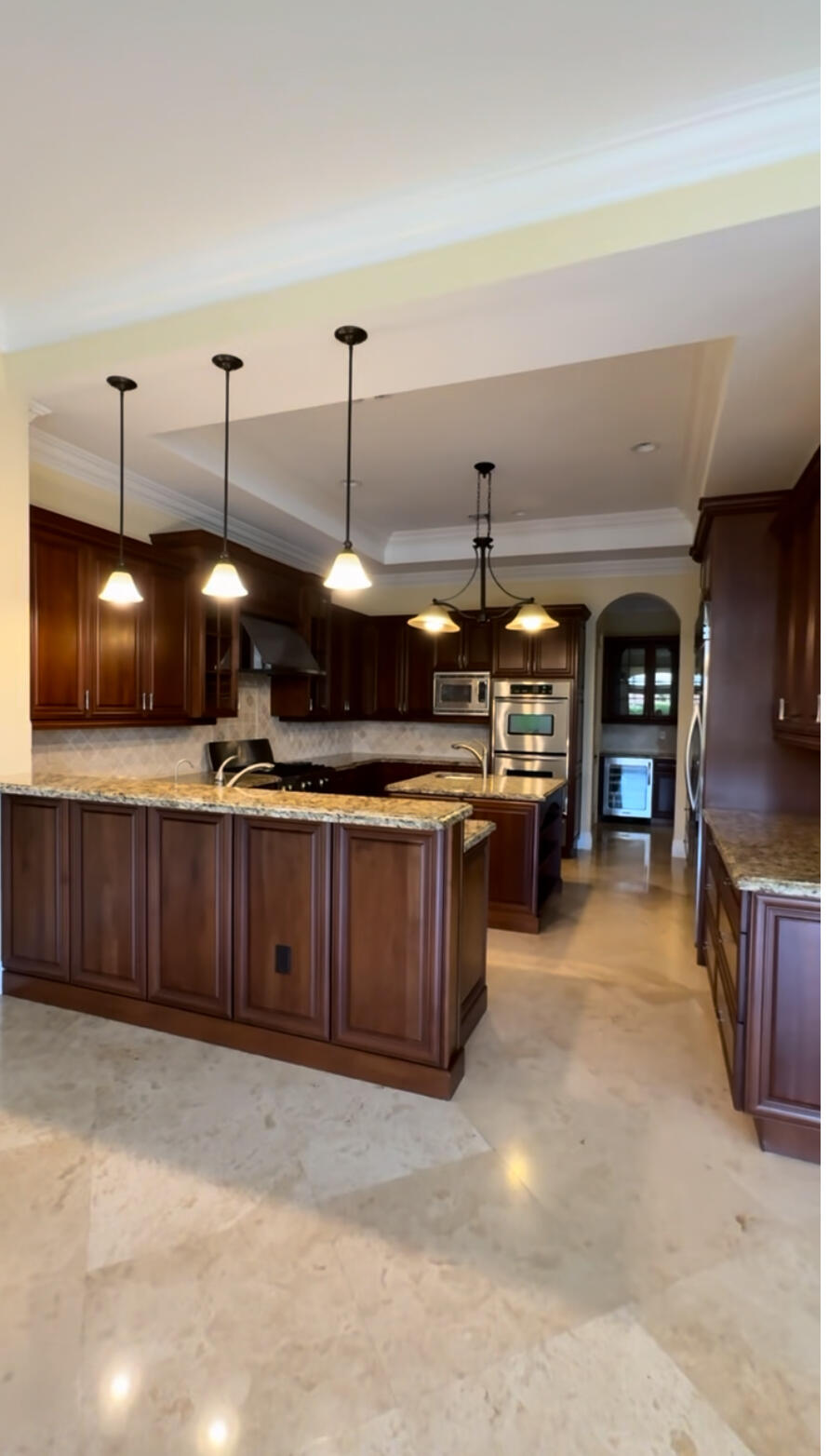 9407 Bridgebrook Drive Boca Raton, FL 33496 - Photo 6 of 32 a view of a kitchen with a sink and cabinets