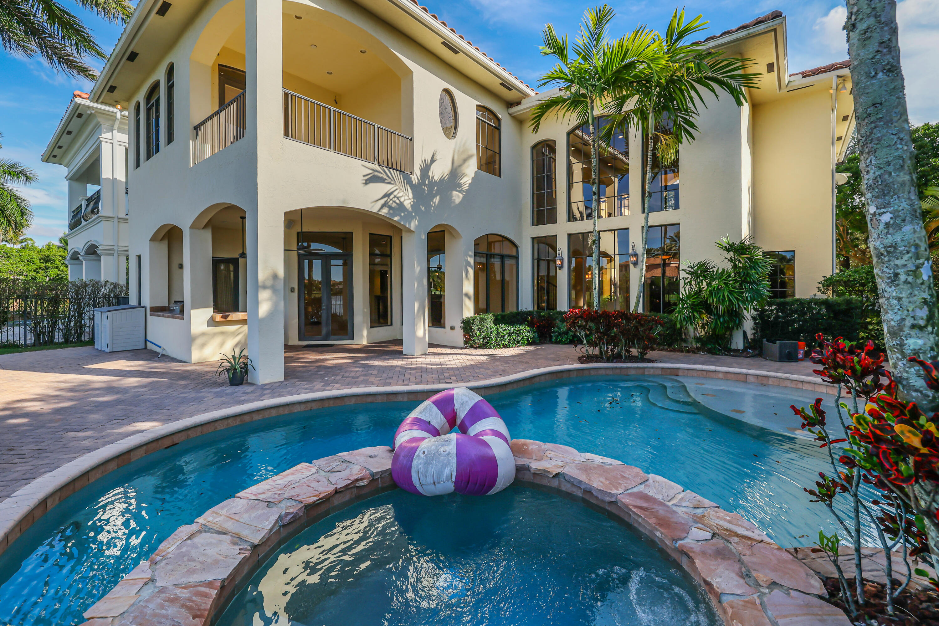 9407 Bridgebrook Drive Boca Raton, FL 33496 - Photo 61 of 89 a swimming pool with outdoor seating and yard