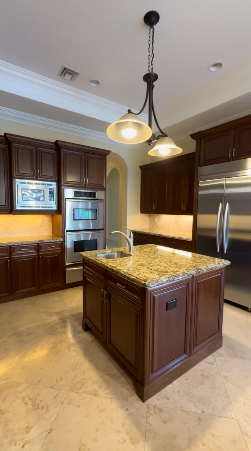 9407 Bridgebrook Drive Boca Raton, FL 33496 - Photo 7 of 32 a kitchen with stainless steel appliances granite countertop a sink and a stove
