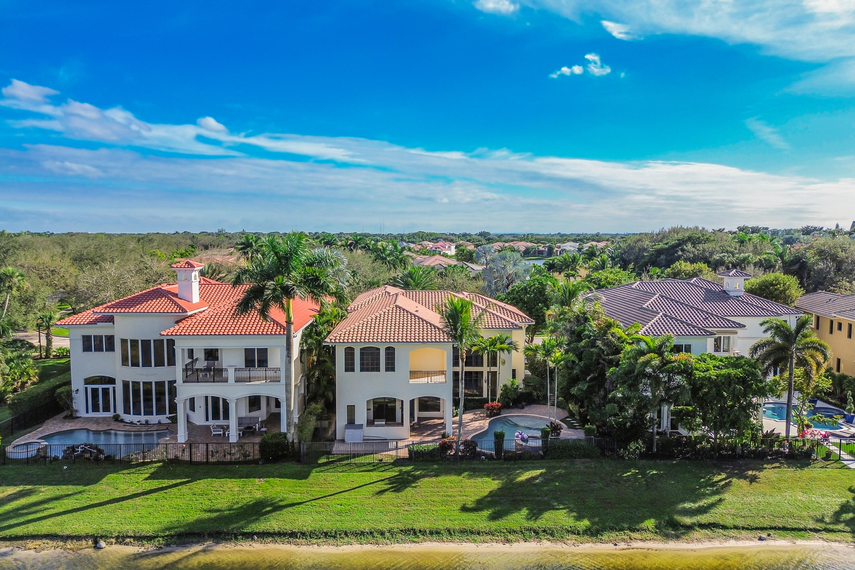 9407 Bridgebrook Drive Boca Raton, FL 33496 - Photo 74 of 89 a view of a big yard with table and chairs under an umbrella