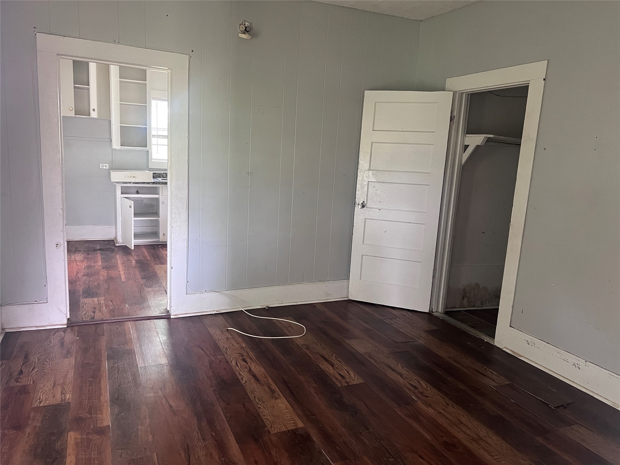 613 Harrison Lane Wharton, TX 77488 - Photo 6 of 10 an empty room with wooden floor & closet