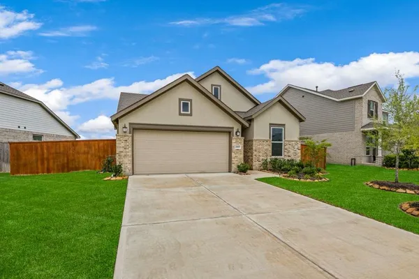 a front view of a house with yard