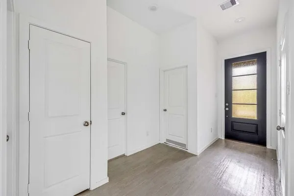 a view of room with window and hardwood floor