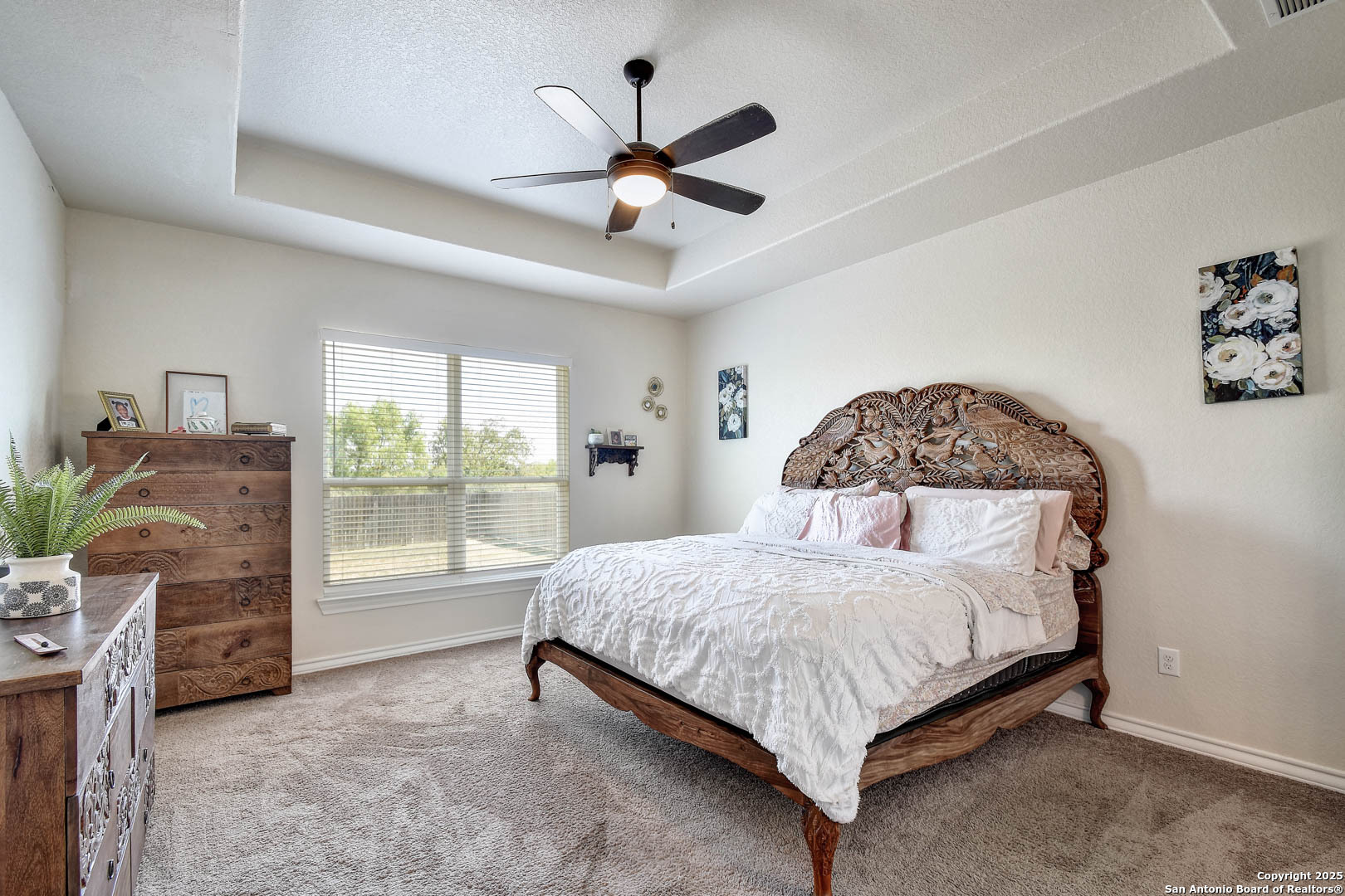 7327 Lunar Eclipse Converse, TX 78109 - Photo 12 of 24 a bedroom with a bed and a large window