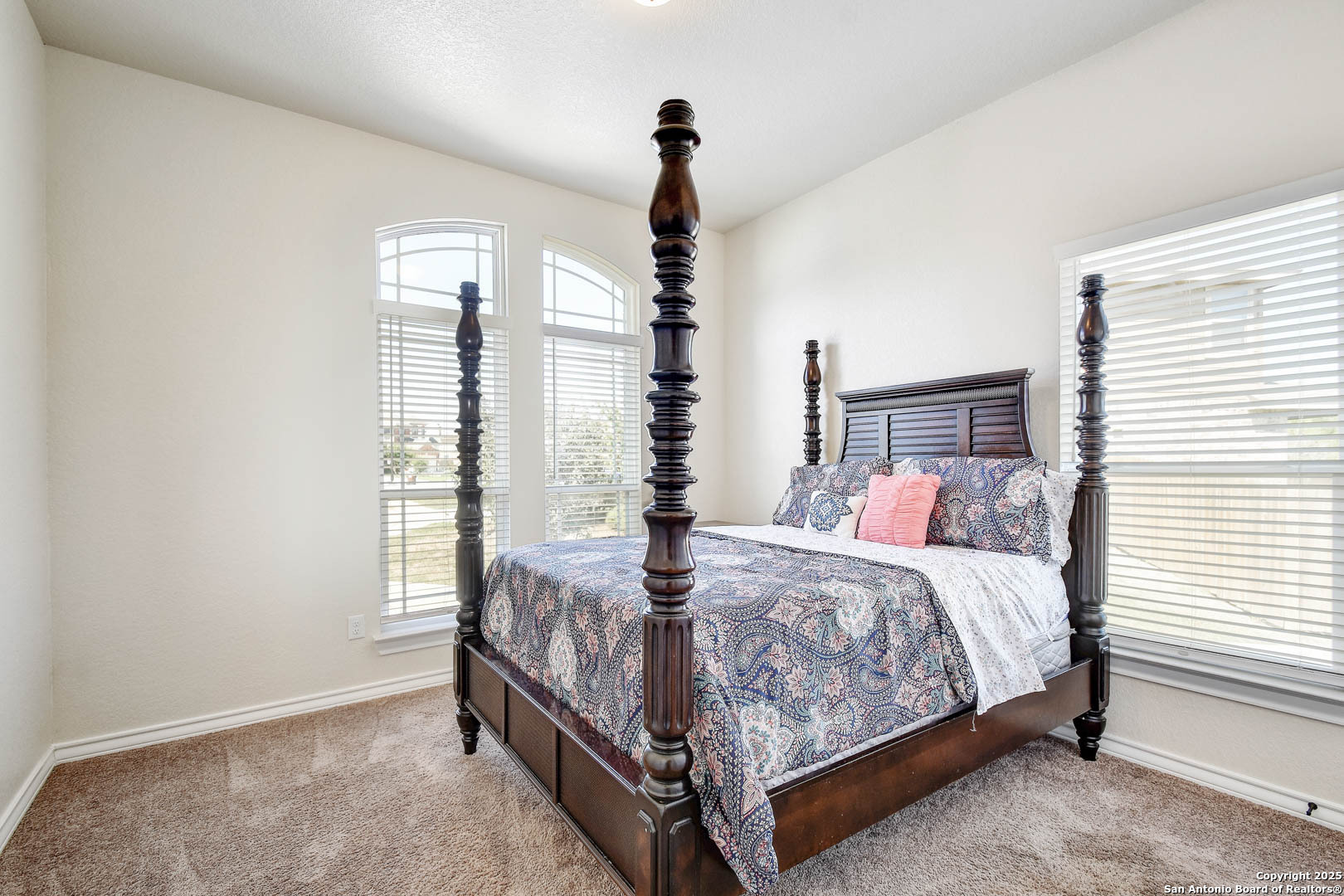 7327 Lunar Eclipse Converse, TX 78109 - Photo 17 of 24 a bed sitting in a bedroom next to a window