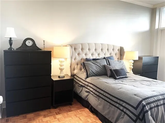 a bedroom with a bed and window