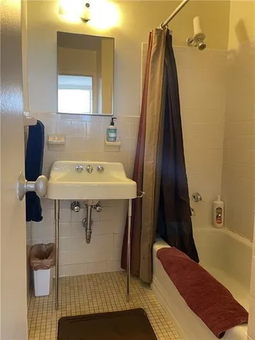 a bathroom with a sink toilet and tub