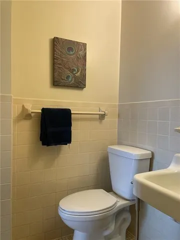 a toilet sitting next to a bathroom