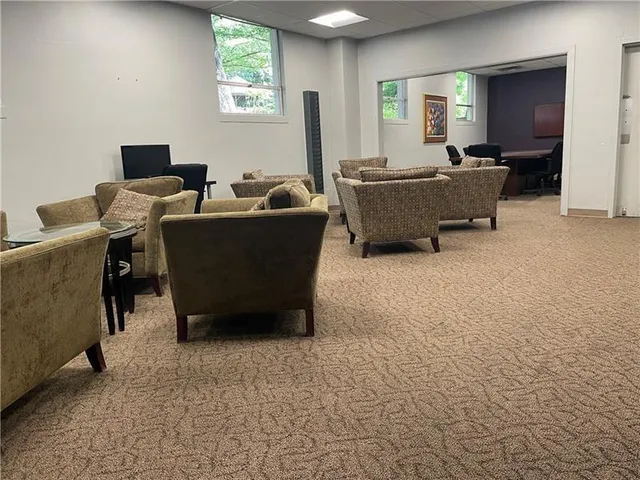 a kitchen with a sink a stove a table and chairs
