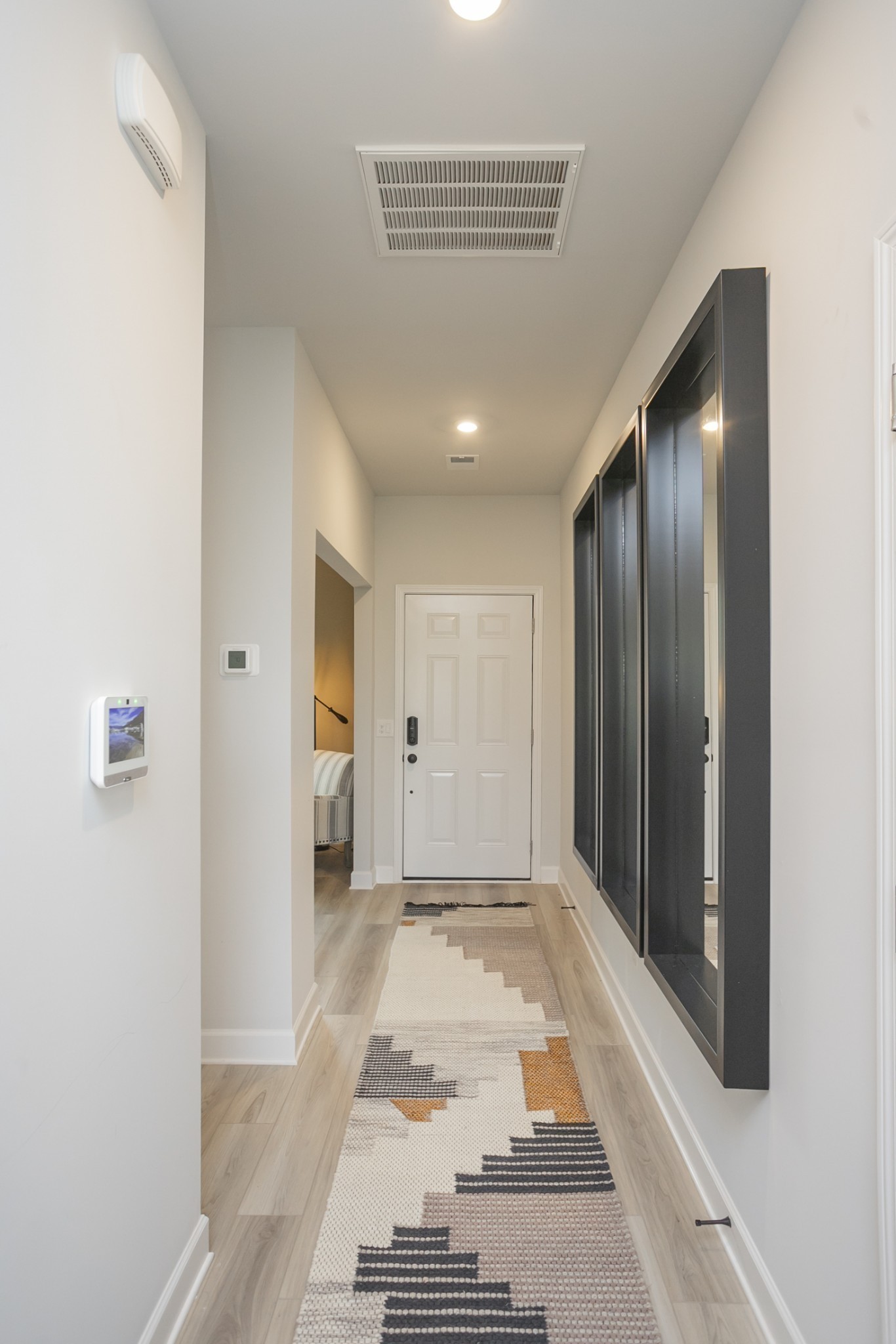 321 Ellis Lane Lebanon, TN 37087 - Photo 11 of 30 a view of a hallway with wooden floor and a bathroom
